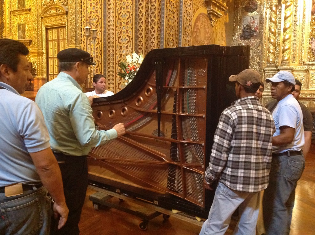 Piano is moved with much care